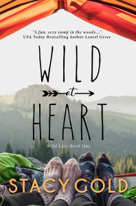 Wild at Heart book cover image of two sock covered feet in the open doorway of an orange tent, with mountains in the distance